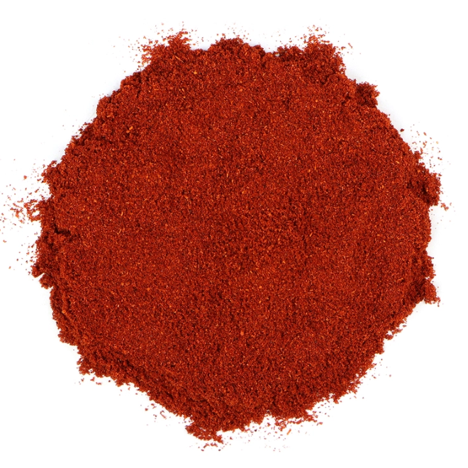 Smokey red paprika on a white surface.