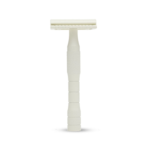 Image of a cream safety razor on a white background.